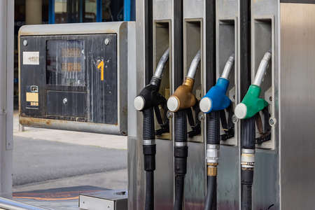 Pump nozzles of a petrol pump in service stationのeditorial素材