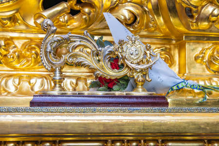 Huelva, Spain - April 10, 2022: Detail of the knocker (llamador) to give an order to the costalero bearers under the platformの写真素材
