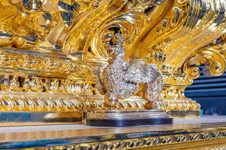 Golden Knocker (callador) in the front of a paso (Platform or throne) of Holy Weekの写真素材