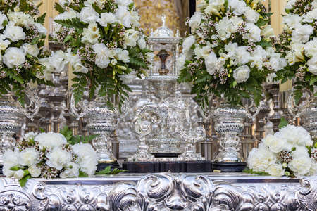 Detail of the knocker in the form of a sitting silver Angel in a Holy Week platform or throne