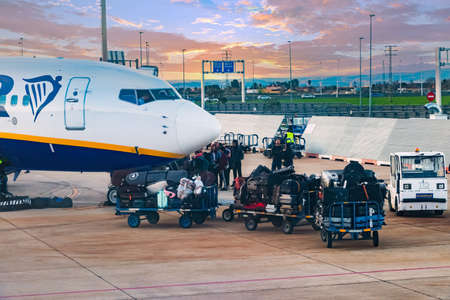 Seville, Spain - March 19, 2018: People and luggage boarding in a low cost fly from Ryanair airline in Seville airportのeditorial素材