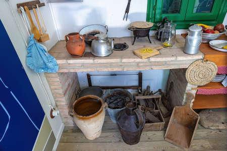 Old kitchenware utensils on an old kitchen of a country houseの写真素材