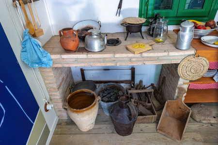 Old kitchen utensils on a wall shelfの写真素材
