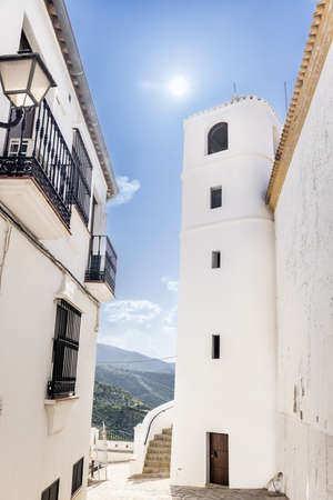 The Clock Tower of Zahara de la Sierra dates from the 16th century. Attached to the previous one, it appears as the only remnant of the old Hermitage with a square floor plan and rounded corners.の写真素材