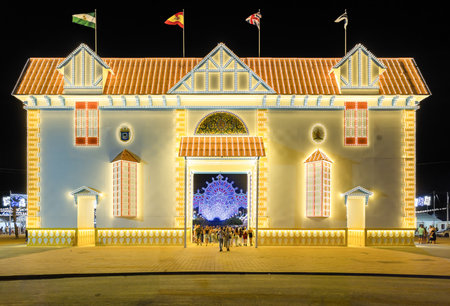 Huelva, Spain - August 1, 2022: Illuminated doorway for the 2022 Colombine festivities, which recreates one of the 274 homes in the Reina Victoria neighborhood, also known as Barrio Obreroのeditorial素材