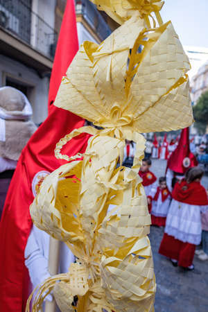 Detail of a Palm made in Elche, Spain, carried by a Nazarene and penitent, in Palm Sunday, during Holy Week, in the La Borriquita processionの写真素材