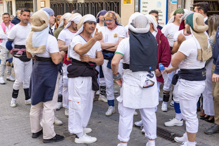 Huelva, Spain - April 10, 2022: A group of costalero bearers with the Costal (Sack) Piece of cloth that bearers place on their head and neck to better carry the steps (platform or Throne) of Holy weekのeditorial素材