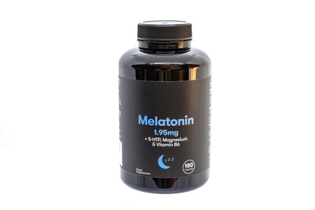 Bottle of pills of Melatonin 1.95 mg and 5-HTP, Magnesium and Vitamin B6のeditorial素材