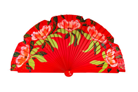 Spanish red open hand fan, decorated with floral motifs, isolated on white backgroundの写真素材