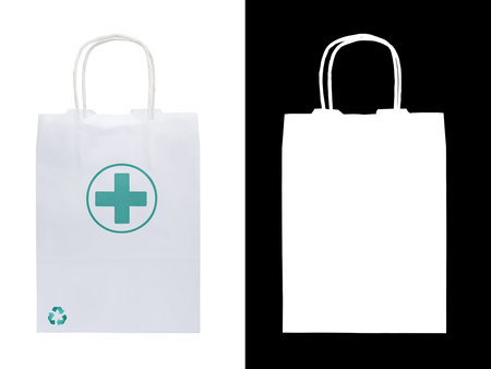 White paper bag with a green Pharmacy and Recyclable logos. Isolated on white background with clipping maskの写真素材