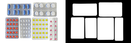 Pills of different colors in blister, isolated on white background with clipping mask and pathの写真素材