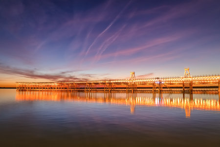 Mining pier known as the Tinto Dock "Muelle del Tinto" at night. This is one of the remains left by the English in Huelva.の写真素材