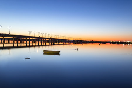 Long time exposure photograph of the Puente del Odiel or Puente-SifÃ³n Santa Eulalia at sunset in Huelva, Andalusia, Spainの写真素材