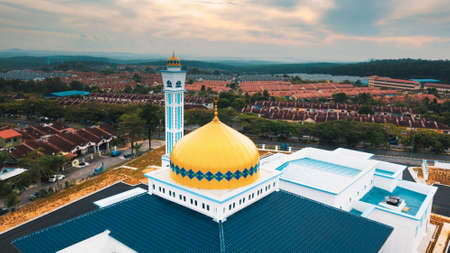 The minarat of a mosque during sunrise in Malaysiaの写真素材