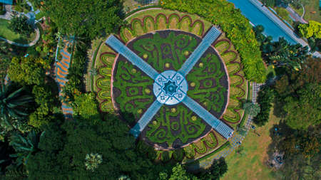 Aerial view of a fountain centerpiece in a gardenの写真素材