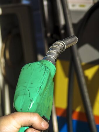 Sao Paulo, Brazil, August 15, 2007. Gas nozzle in man's handのeditorial素材