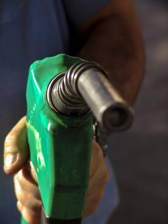 Sao Paulo, Brazil, August 15, 2007. Gas nozzle in man's handのeditorial素材