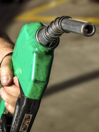 Sao Paulo, Brazil, August 15, 2007. Gas nozzle in man's handのeditorial素材