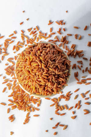 red integral rice on glass bowl isolated on white background in Brazilの写真素材