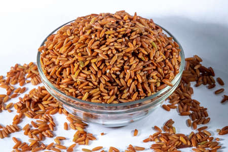 red integral rice on glass bowl isolated on white background in Brazilの写真素材