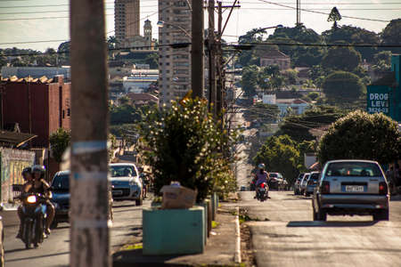 Orlandia, Sao Paulo, Brazil, March 28, 2015. Traffic and perspective of an avenue in the center of Orlandiaのeditorial素材