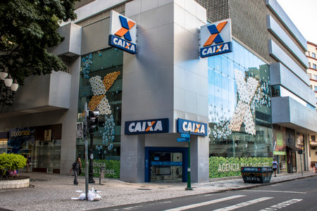 Curitiba, Parana, January 03, 2018. Caixa Economica Federal Government Bank Logo on Agency Entrance...