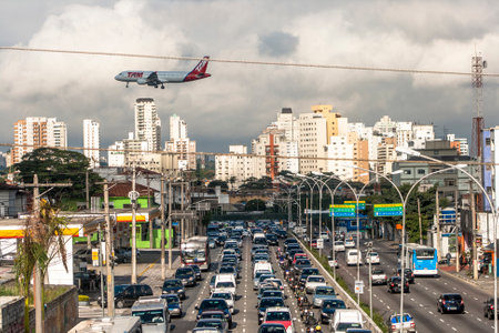 Sao Paulo, Brazil, May 16, 2012. Heavy traffic of Washington Luiz Avenue, with plane landing at Congonhas airport, south of Sao Pauloのeditorial素材
