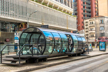 Curitiba, Parana, January 03, 2018. View of the passenger movement in the tube station, tube-shaped bus stop of the Integrated Transport Network, in downtown of Curitiba.のeditorial素材
