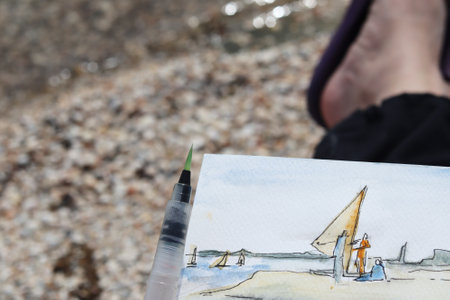 Sea sketch in watercolor. Artist painting landscapeの写真素材