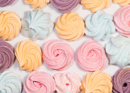 Meringues Closeup of mini color sweetsの写真素材