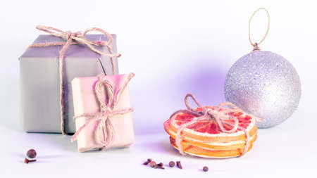 Christmas gifts in craft style with slices of dry grapefruitの写真素材