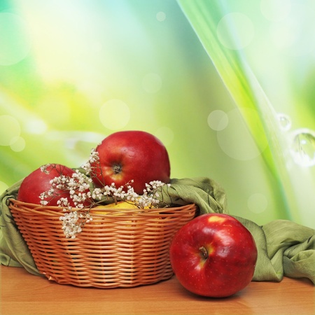 Red and yellow apples in the basket の写真素材