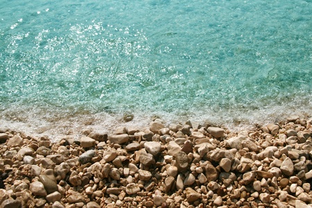 beach with sea waves and stones  の写真素材