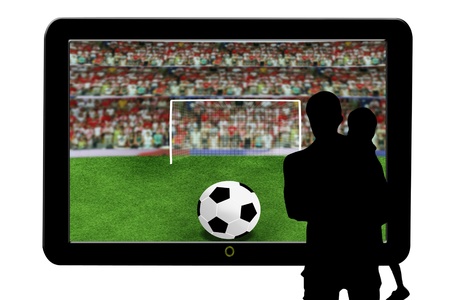 father and son watching soccer ball in television の写真素材