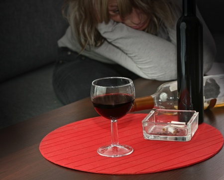 lonely and desperate - portrait of middle-aged woman with addiction problems の写真素材