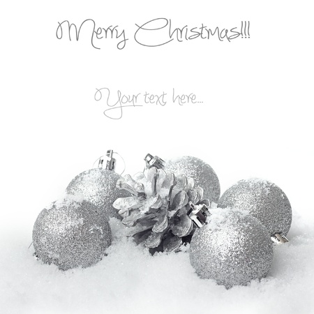 Christmas ball baubles with silver decoration on the snowの写真素材