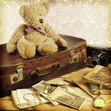 old suitcase, books, photos in retro styleの写真素材