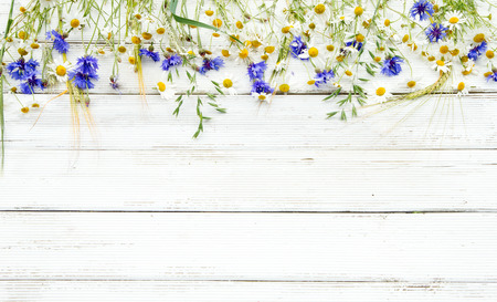 Summer wildflowers and rye on wooden backgroundの写真素材