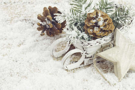 Christmas background with decoration with light star, cones and twigs