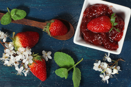 fresh strawberries on the blue wooden backgroundの写真素材
