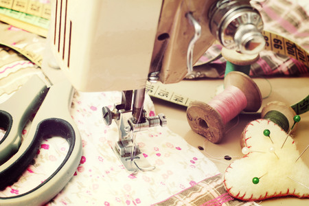 sewing machine, dressmaker scissors and thread-style retroの写真素材