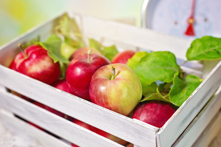 fresh red apples in wooden boxの写真素材