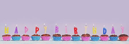 birthday chocolate cupcakes with candelsの写真素材