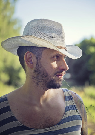 Handsome man wearing sun hatの写真素材