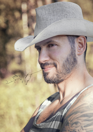 Handsome man wearing sun hatの写真素材