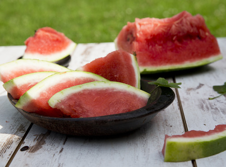slice Watermelon on the table in gardenの写真素材