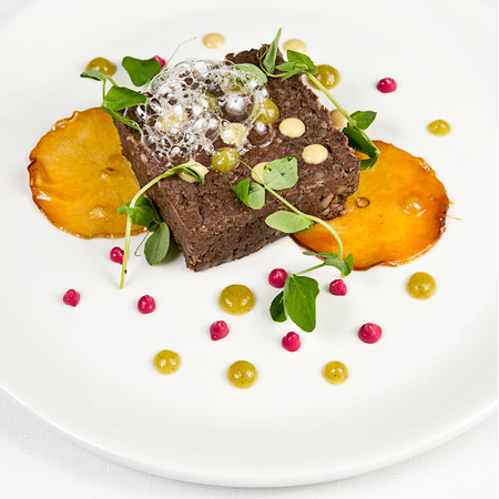 roasted wild boar pate with candied applesの写真素材