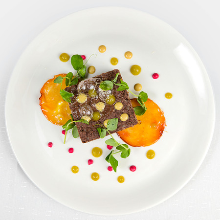 roasted wild boar pate with candied applesの写真素材