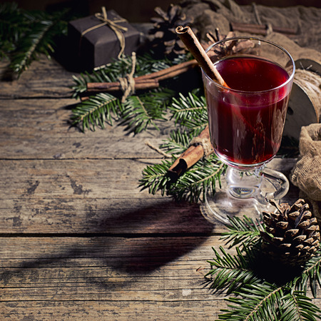Hot tasty spicy mulled red wine with cinnamonの写真素材