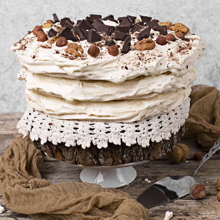 Meringue Cake Pavlova with cream and nutsの写真素材
